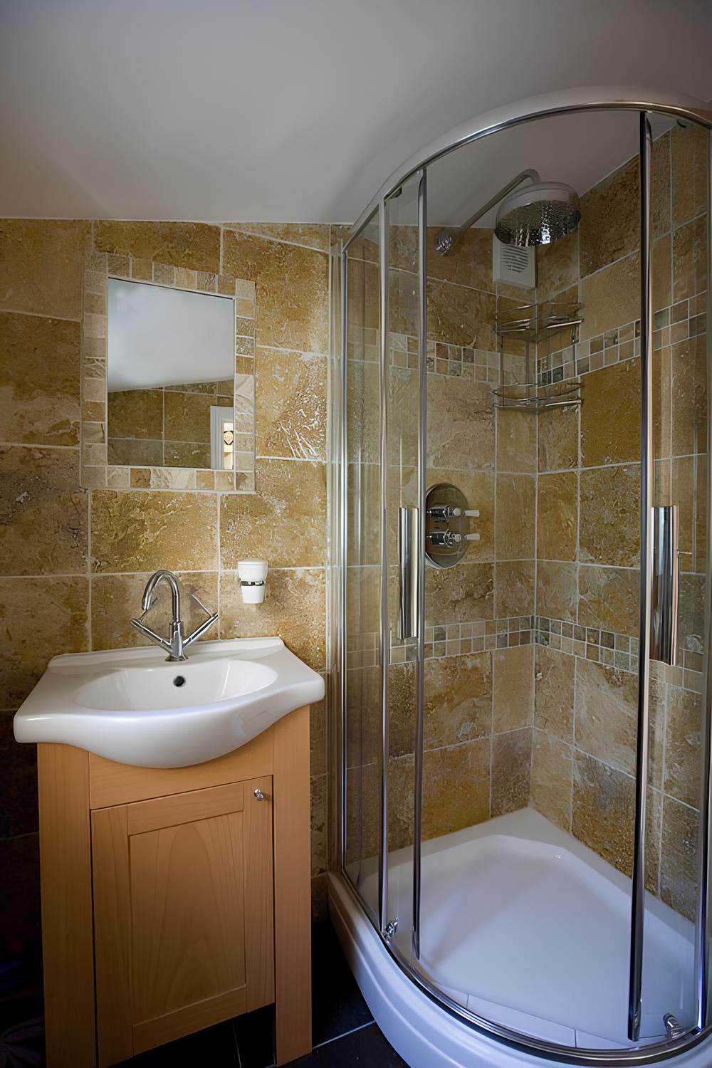 Bathroom with travertine tiles and walk-in shower